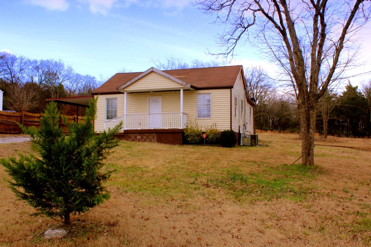313 Randy Road Madison, TN 37115 - Photo 22 of 22 a front view of a house with a yard covered with snow