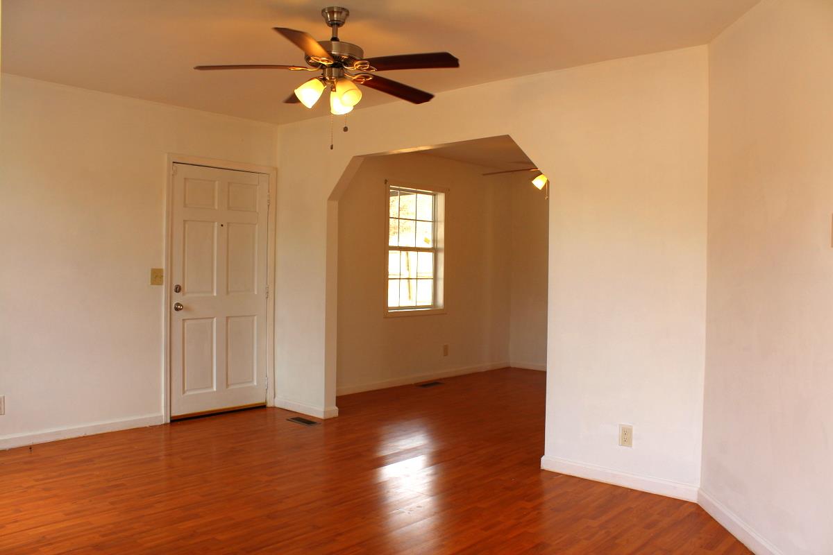 313 Randy Road Madison, TN 37115 - Photo 8 of 22 a view of an empty room with wooden floor and a window