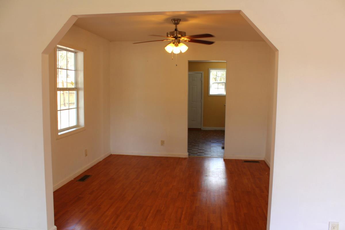 313 Randy Road Madison, TN 37115 - Photo 9 of 22 a view of empty room with wooden floor and fan