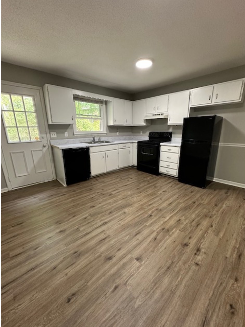 1533 Old Lascassas Road Murfreesboro, TN 37130 - Photo 2 of 13 a large kitchen with stainless steel appliances a large counter top and a stove