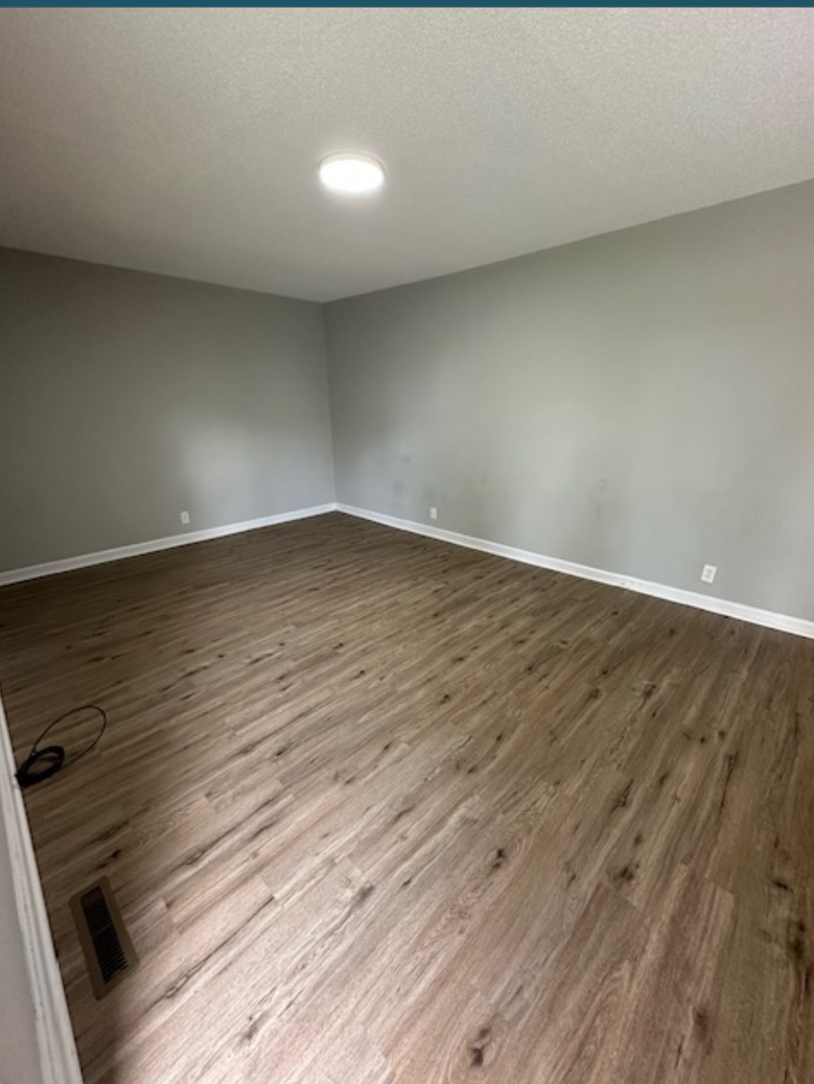 1533 Old Lascassas Road Murfreesboro, TN 37130 - Photo 3 of 13 a view of an empty room and wooden floor