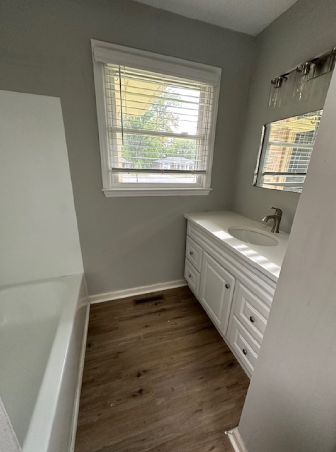 1533 Old Lascassas Road Murfreesboro, TN 37130 - Photo 7 of 13 a bathroom with a sink a mirror and a window