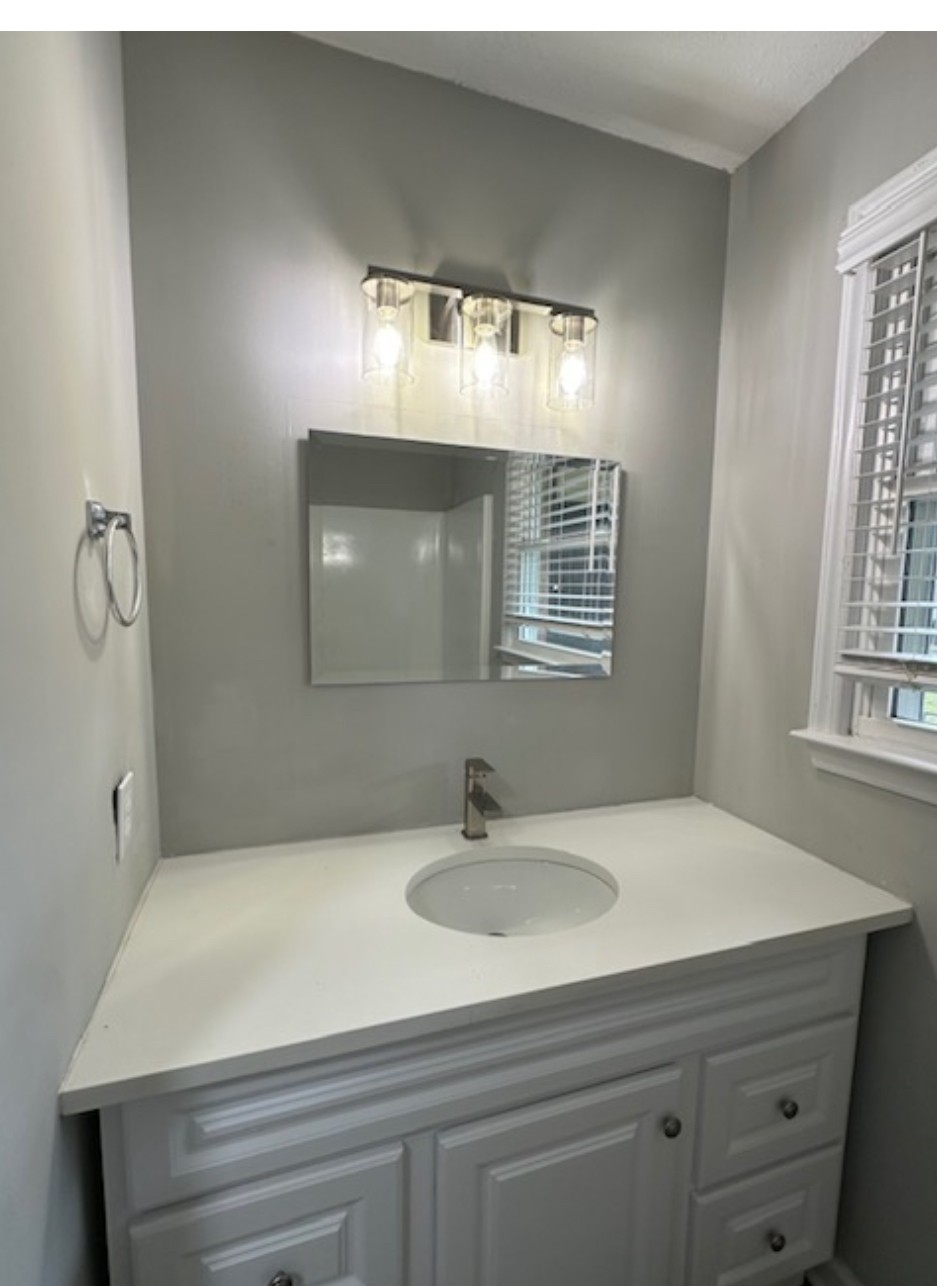 1533 Old Lascassas Road Murfreesboro, TN 37130 - Photo 8 of 13 a bathroom with a sink and a mirror