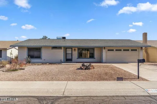a front view of a house with a outdoor space