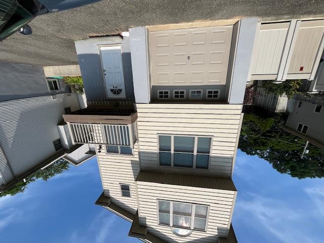 a front view of a house with a garage