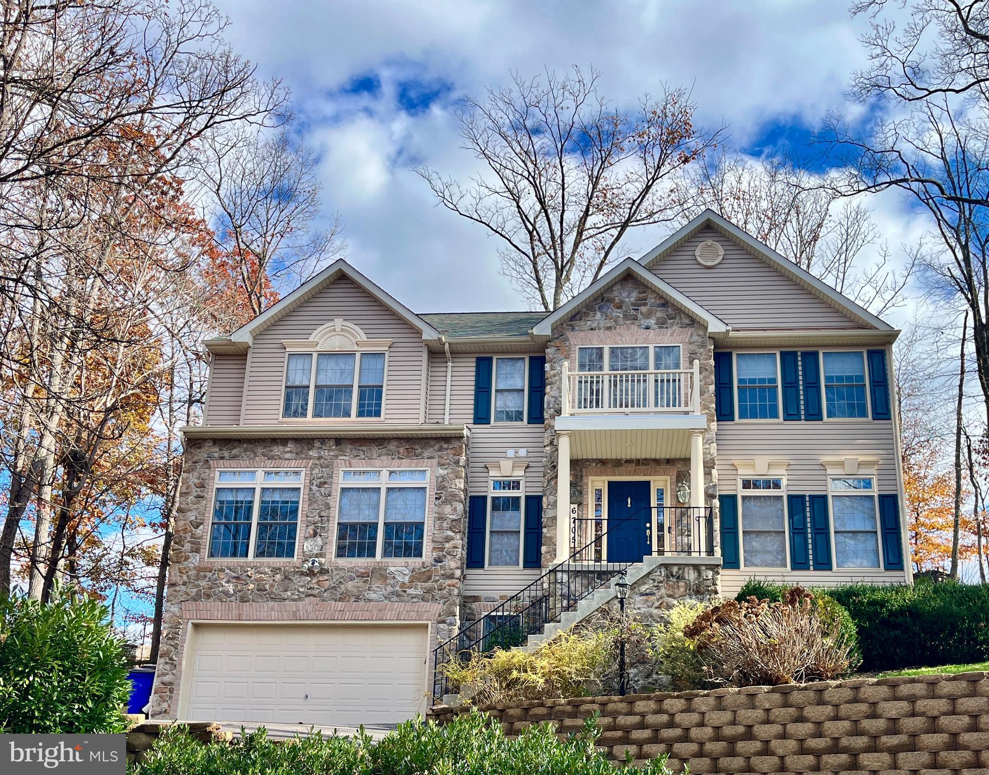 6705 West Lakeridge Road New Market, MD 21774 - Photo 1 of 39 a front view of a house with a garden