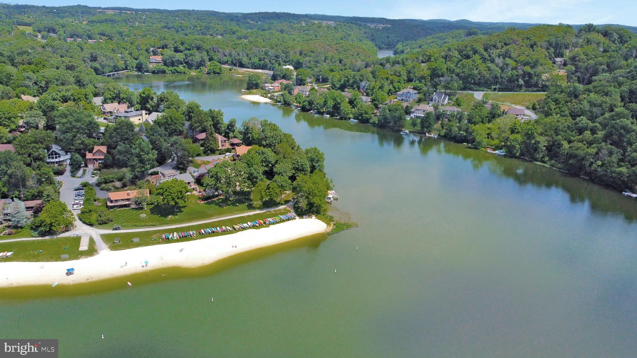 6705 West Lakeridge Road New Market, MD 21774 - Photo 20 of 39 an aerial view of lake residential house with outdoor space and trees all around