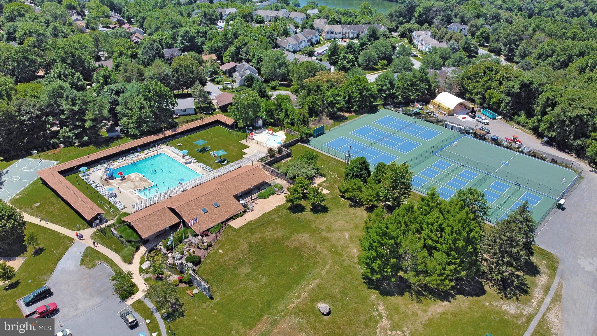6705 West Lakeridge Road New Market, MD 21774 - Photo 2 of 39 an aerial view of a house with a garden and swimming pool