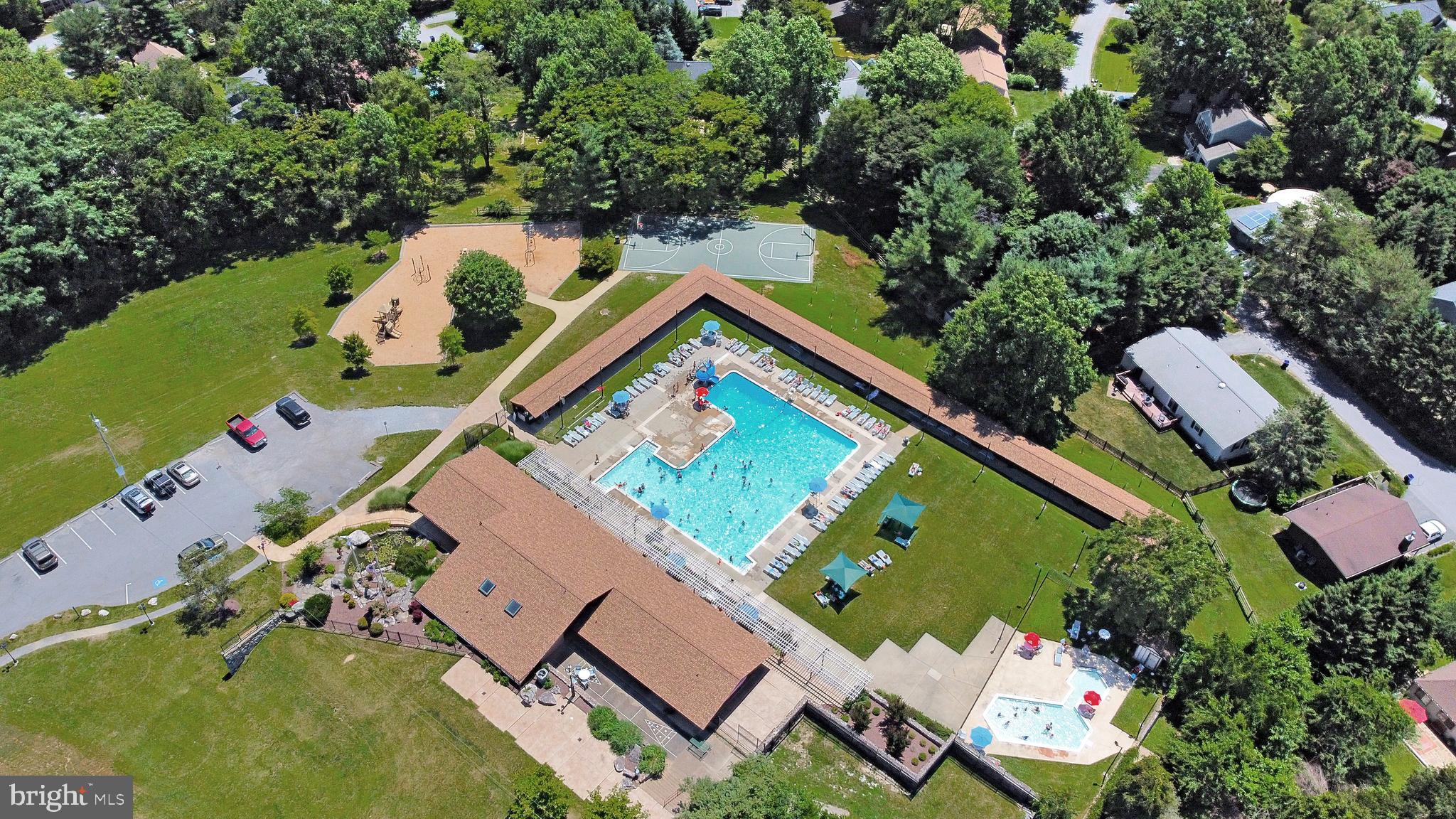 6705 West Lakeridge Road New Market, MD 21774 - Photo 3 of 39 an aerial view of a house with a garden and trees