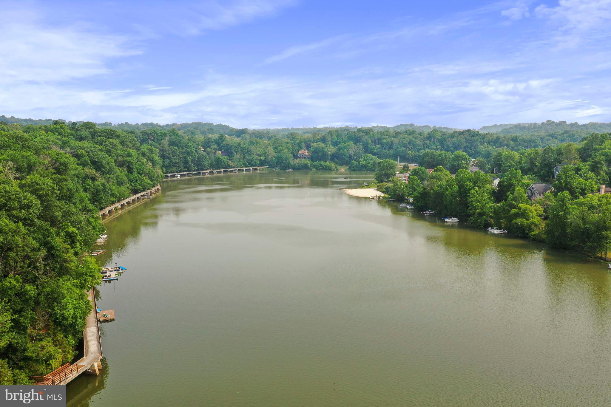 6705 West Lakeridge Road New Market, MD 21774 - Photo 9 of 39 a view of a lake with houses in the back