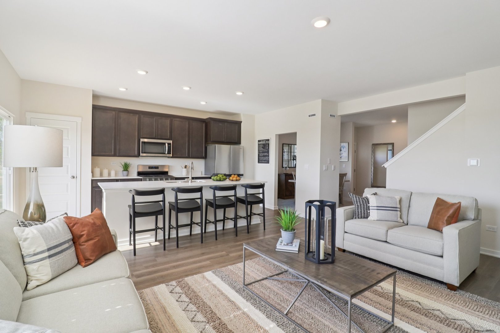1740 Baler Avenue Aurora, IL 60503 - Photo 7 of 32 a living room kitchen with furniture and a dining table with kitchen view