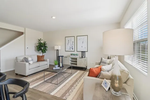 a living room with furniture and a table