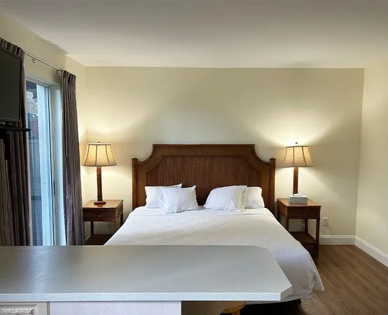 a view of a porch with furniture and garden view