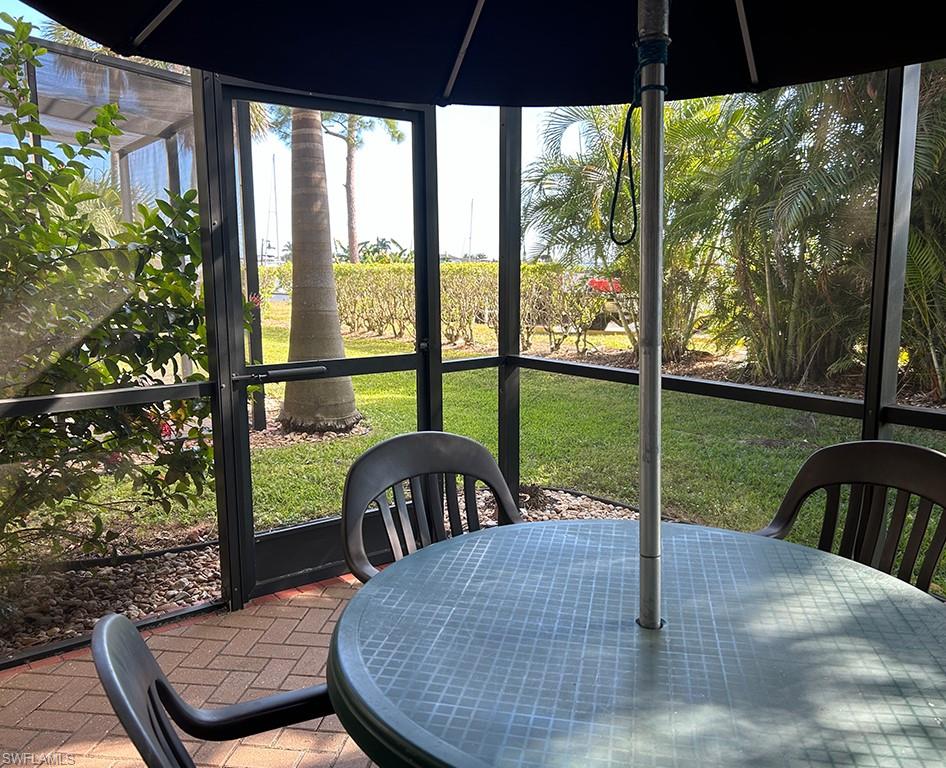 25000 Tamiami Trail East, Unit F179 Naples, FL 34114 - Photo 10 of 13 a view of a porch with furniture and garden view