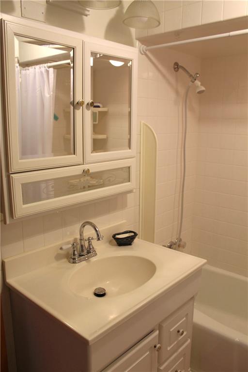 204 Ellsworth Street California, PA 15419 - Photo 13 of 27 a bathroom with a sink and a mirror