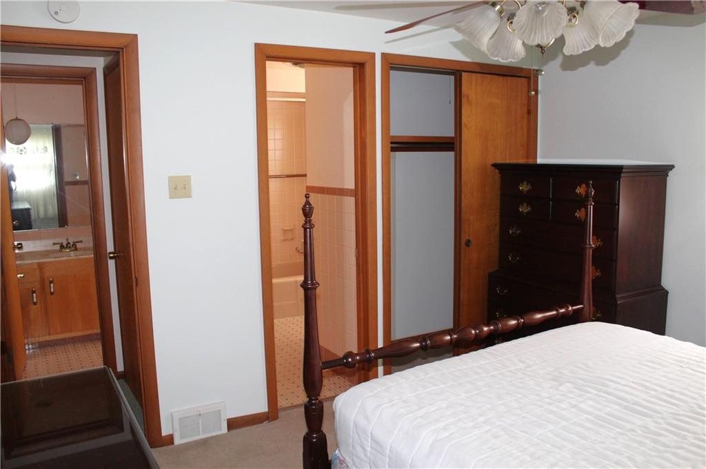 204 Ellsworth Street California, PA 15419 - Photo 15 of 27 a bedroom with a bed and a mirror