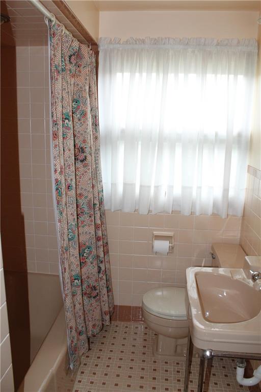 204 Ellsworth Street California, PA 15419 - Photo 18 of 27 a bathroom with a sink a toilet and shower