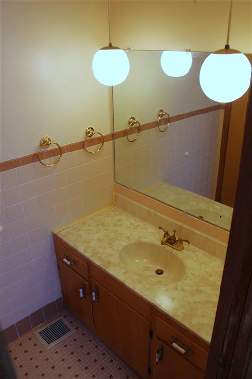 204 Ellsworth Street California, PA 15419 - Photo 19 of 27 a bathroom with a sink and a mirror