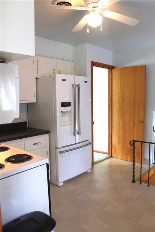 204 Ellsworth Street California, PA 15419 - Photo 8 of 27 a kitchen with a refrigerator a stove and a window