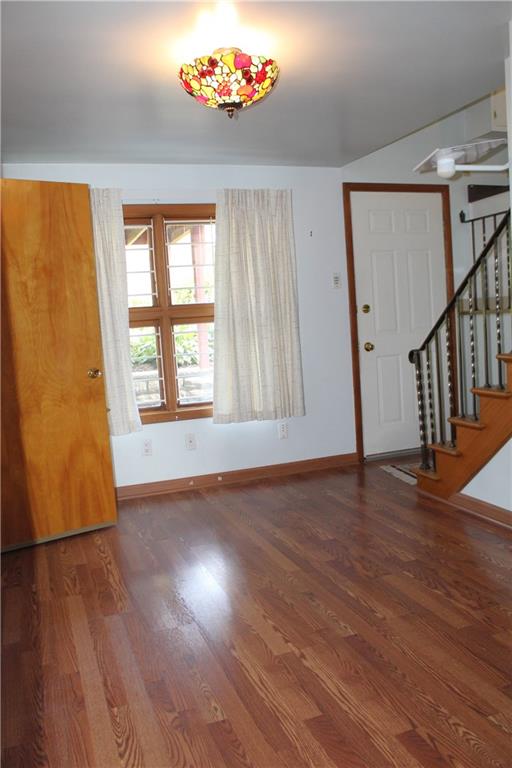 204 Ellsworth Street California, PA 15419 - Photo 10 of 27 a view of an empty room with wooden floor and a window