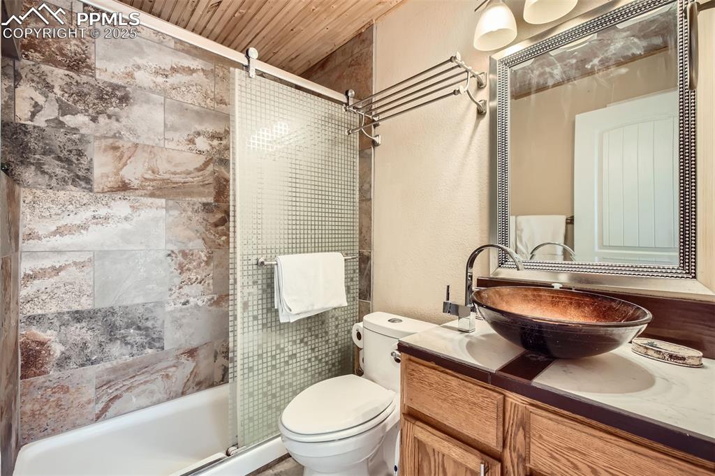 46 Barr Lake Circle Divide, CO 80814 - Photo 20 of 47 a bathroom with a sink a toilet and shower