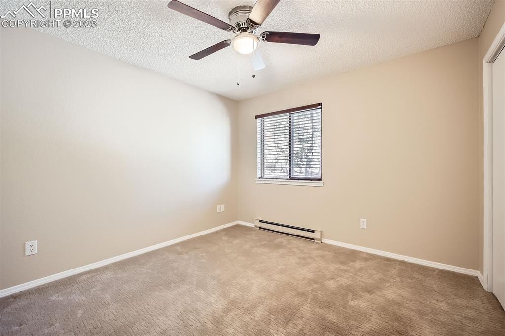 46 Barr Lake Circle Divide, CO 80814 - Photo 21 of 47 an empty room with windows and fan