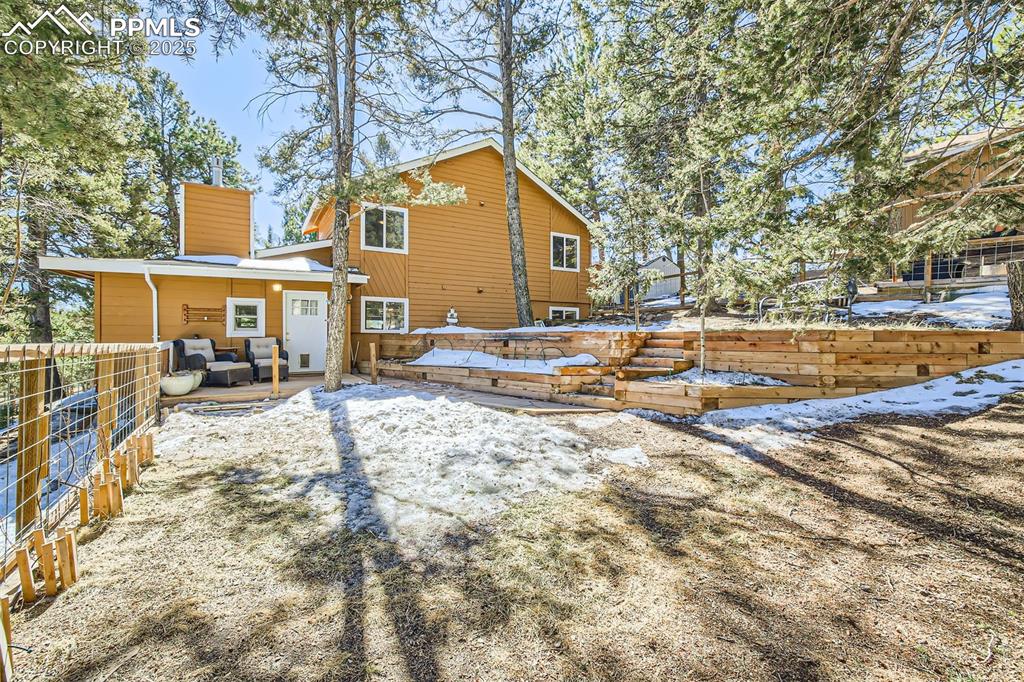 46 Barr Lake Circle Divide, CO 80814 - Photo 26 of 47 a view of a white house with a yard covered in snow