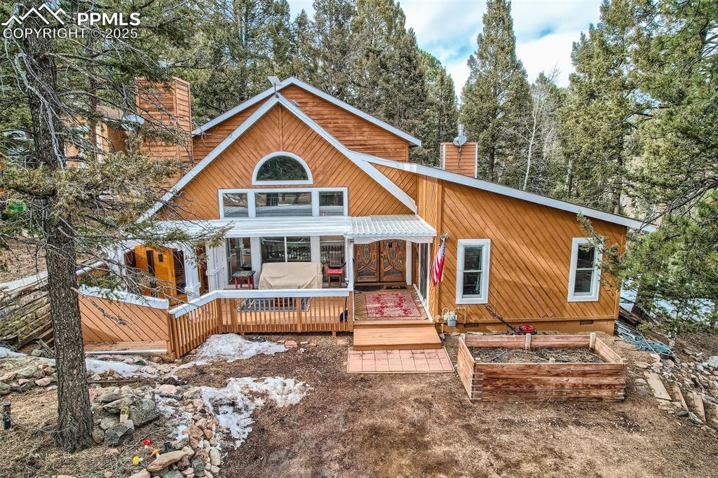 46 Barr Lake Circle Divide, CO 80814 - Photo 27 of 47 a view of a house with a yard and roof deck