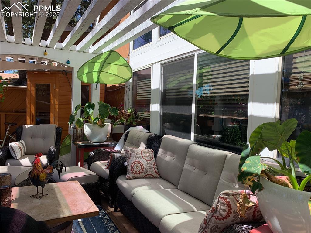 46 Barr Lake Circle Divide, CO 80814 - Photo 42 of 47 a outdoor living space with furniture and umbrella