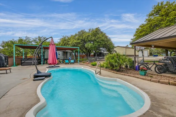a view of a swimming pool with a patio
