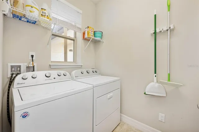 a utility room with dryer and washer