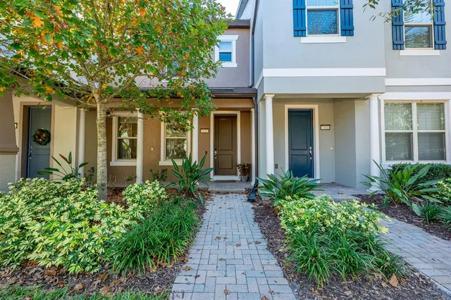 front view of a house with potted plants