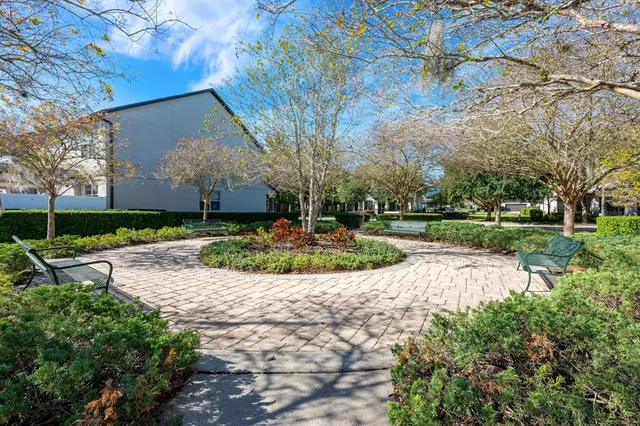 a view of a garden with a fountain