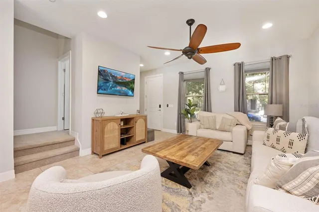 a living room with furniture rug and window