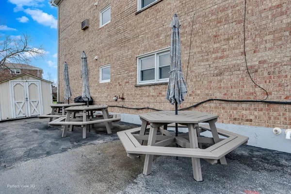 a view of backyard with outdoor seating