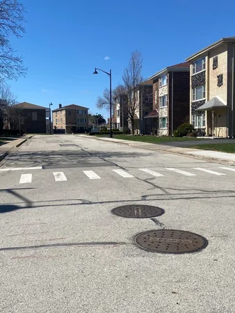 a view of green field with tree in the background