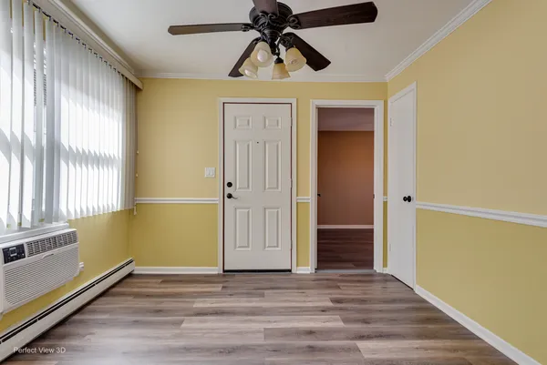 a view of an entryway door with wooden floor