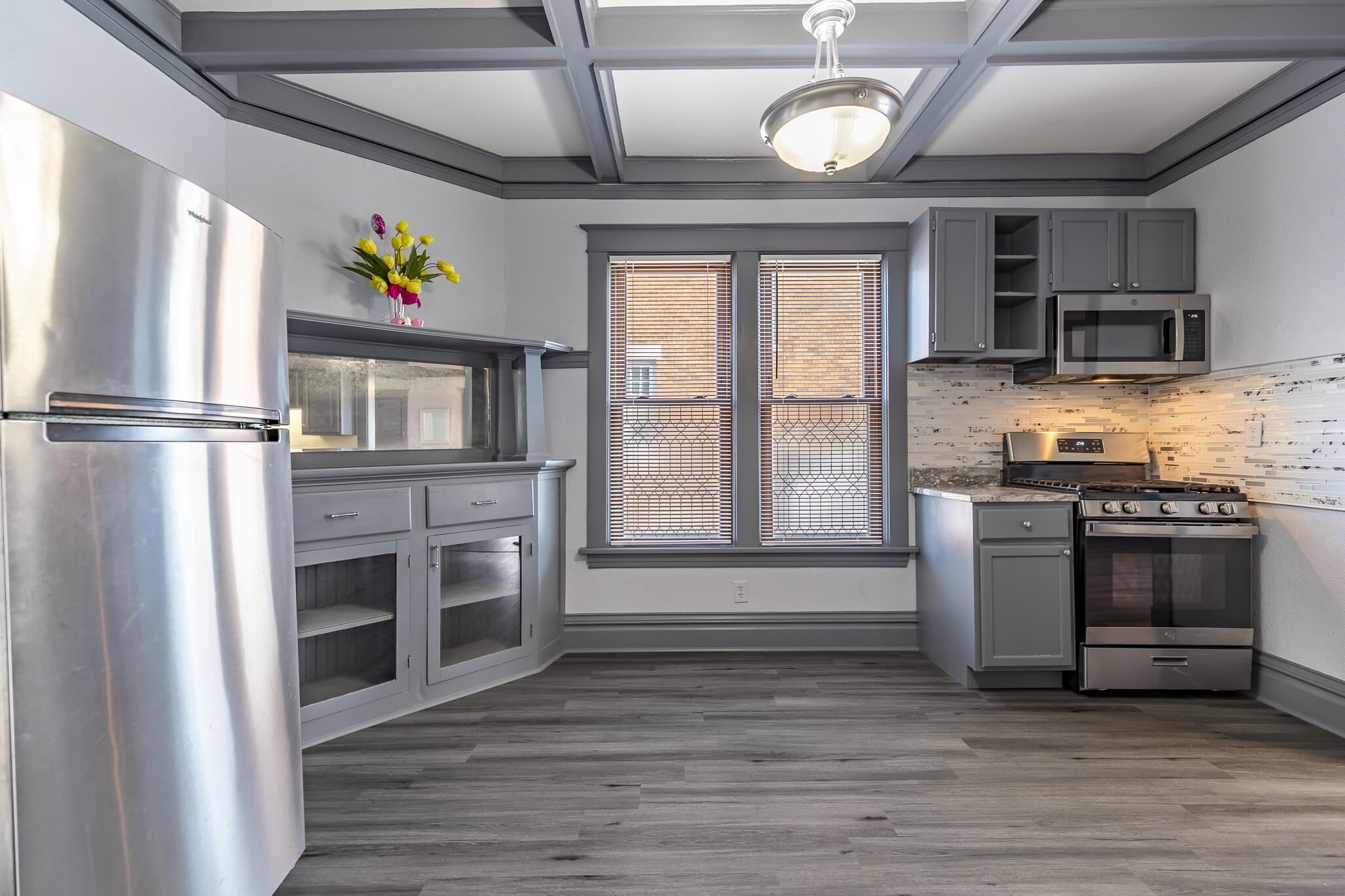 23 Mason Street Hammond, IN 46320 - Photo 11 of 62 a kitchen with stainless steel appliances a stove a refrigerator and a microwave