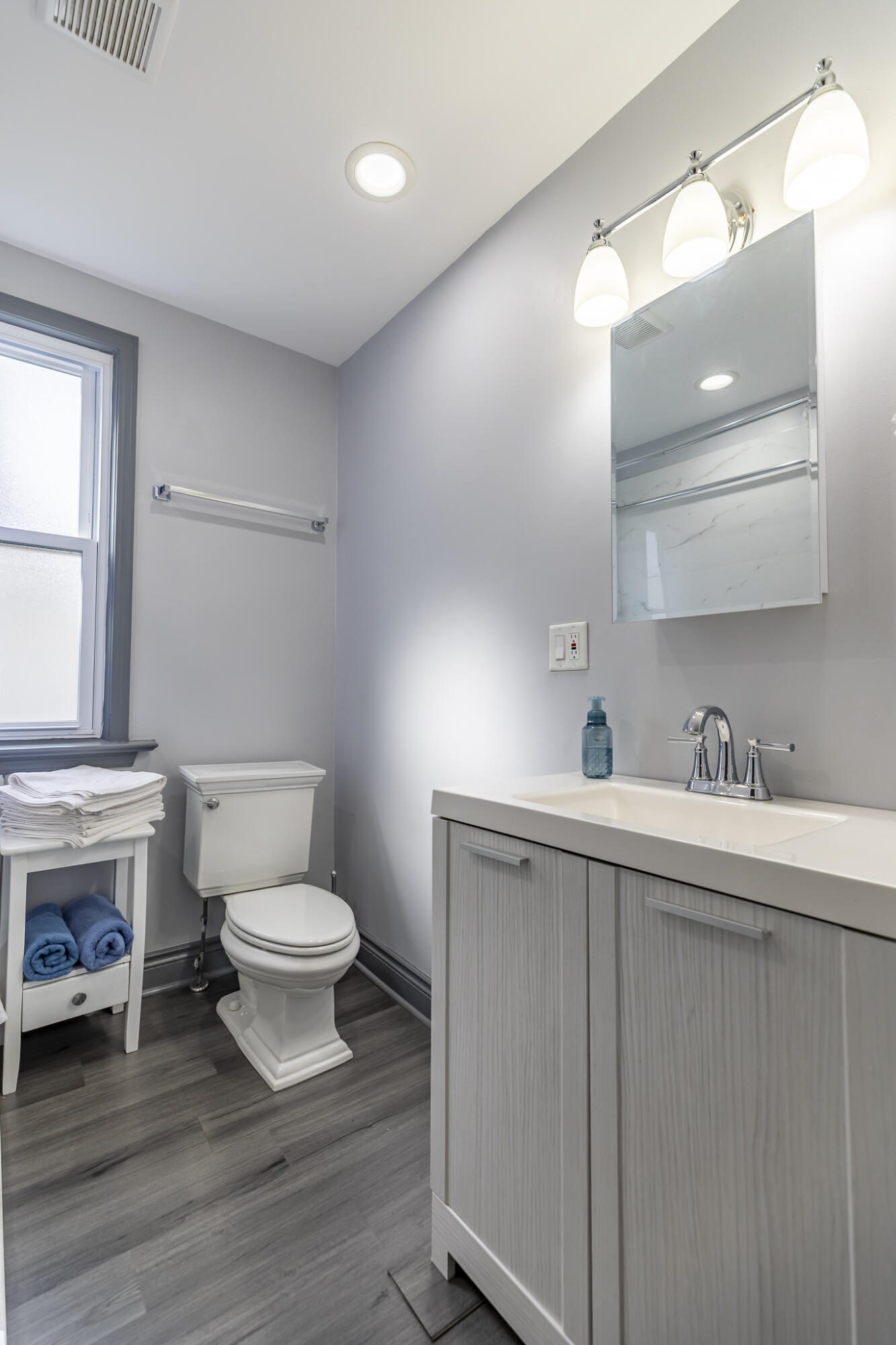 23 Mason Street Hammond, IN 46320 - Photo 15 of 62 a bathroom with a toilet sink a mirror and vanity