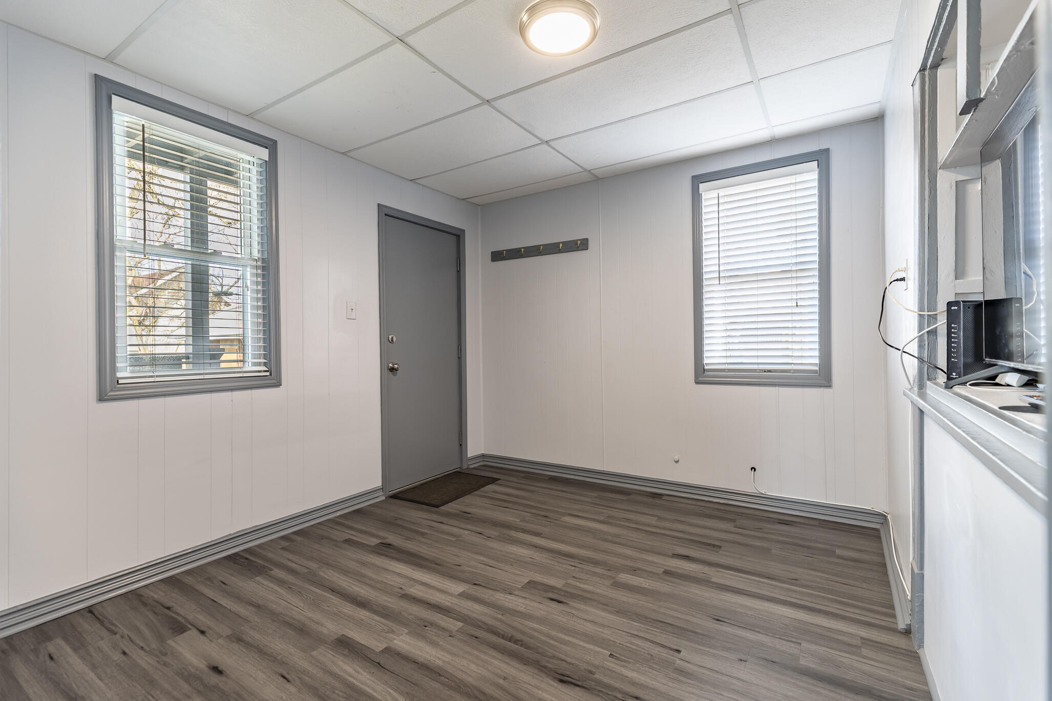 23 Mason Street Hammond, IN 46320 - Photo 20 of 62 an empty room with wooden floor and windows