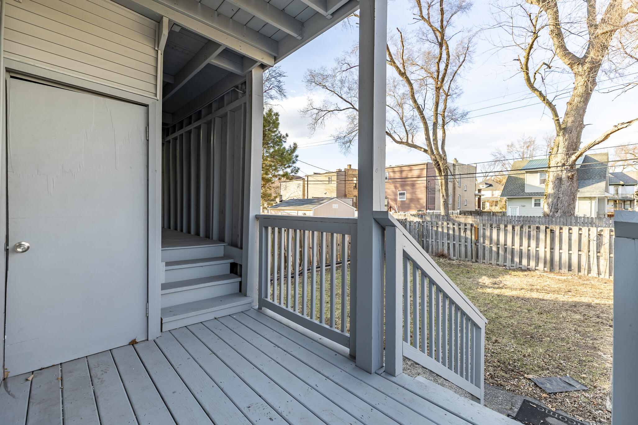 23 Mason Street Hammond, IN 46320 - Photo 23 of 62 a view of a deck with wooden floor and wooden fence