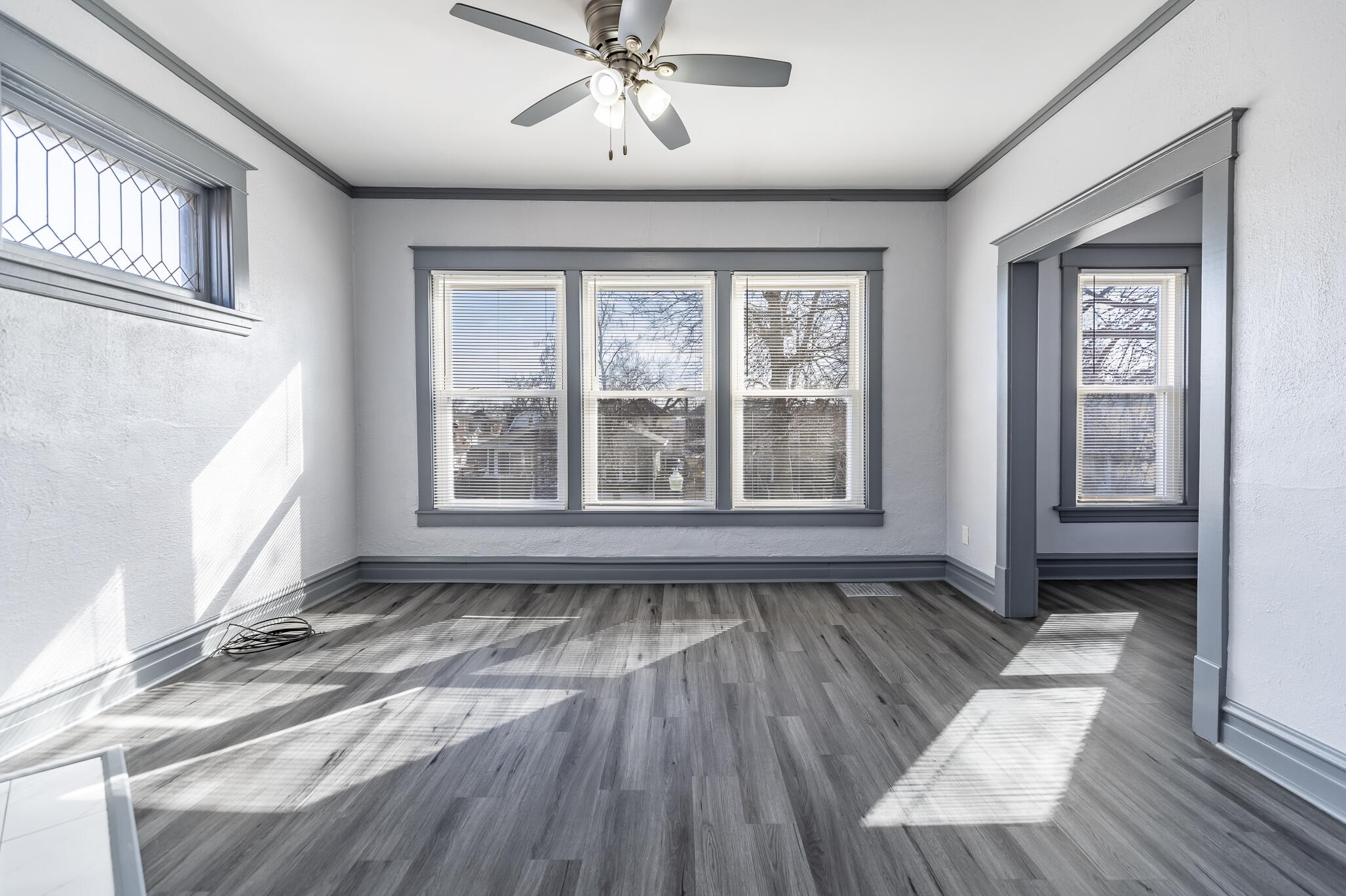 23 Mason Street Hammond, IN 46320 - Photo 26 of 62 a view of an empty room with wooden floor and a window