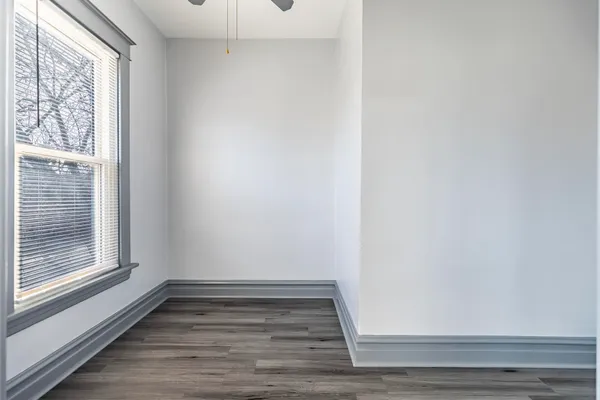 a kitchen with a refrigerator stove and wooden cabinets