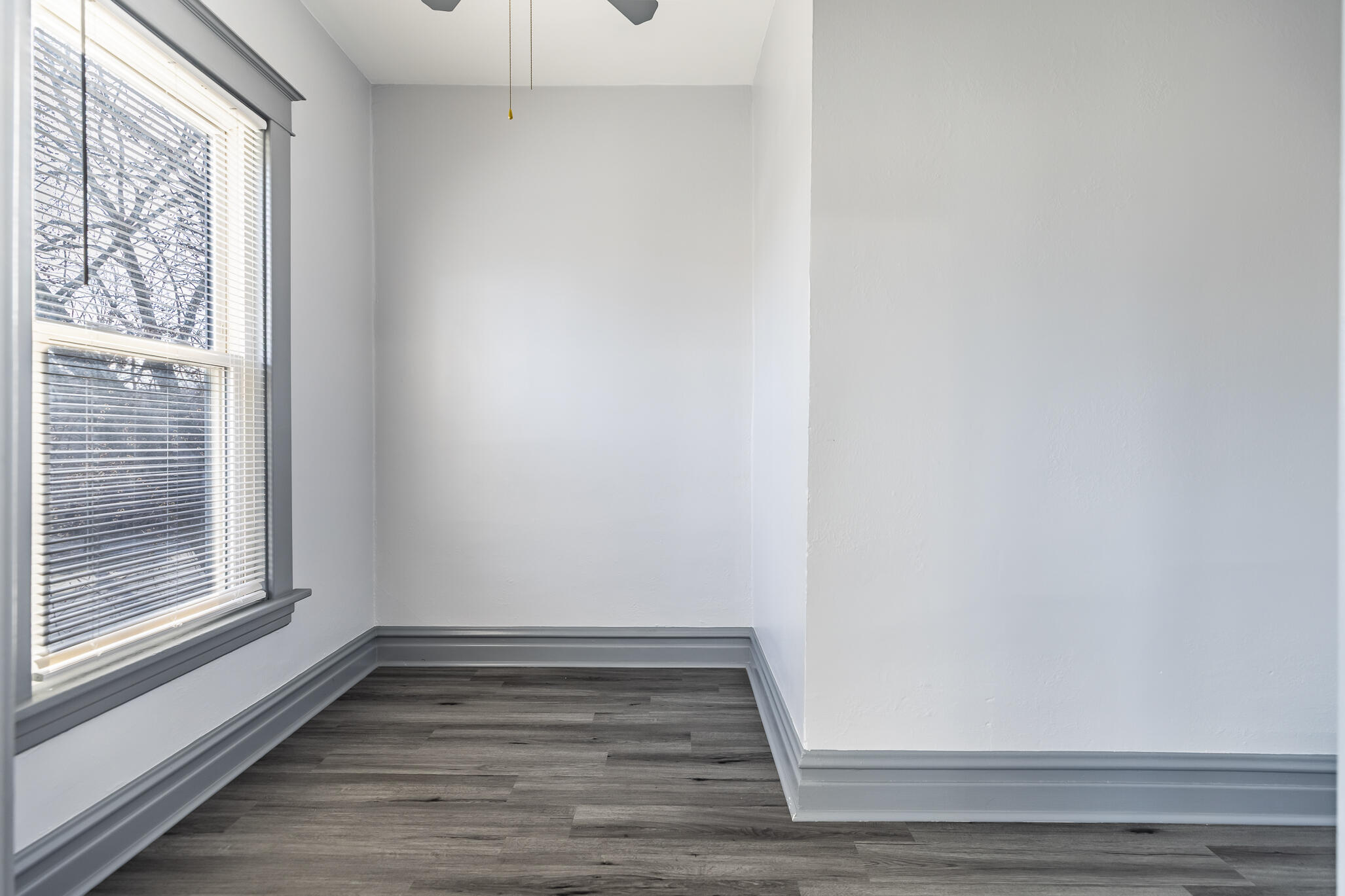 23 Mason Street Hammond, IN 46320 - Photo 27 of 62 a view of an empty room with wooden floor and a window