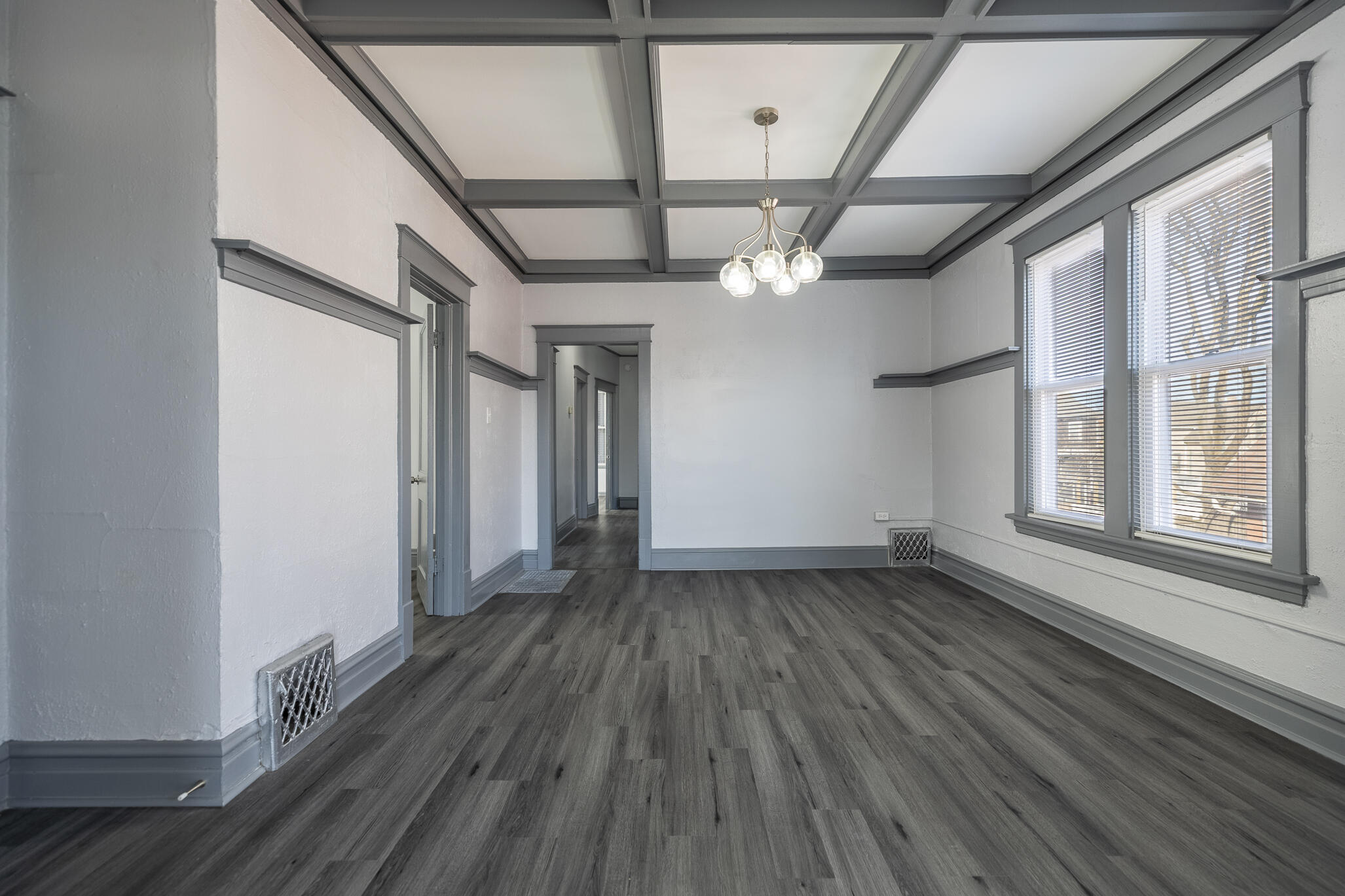 23 Mason Street Hammond, IN 46320 - Photo 30 of 62 a view of an empty room with wooden floor and a window