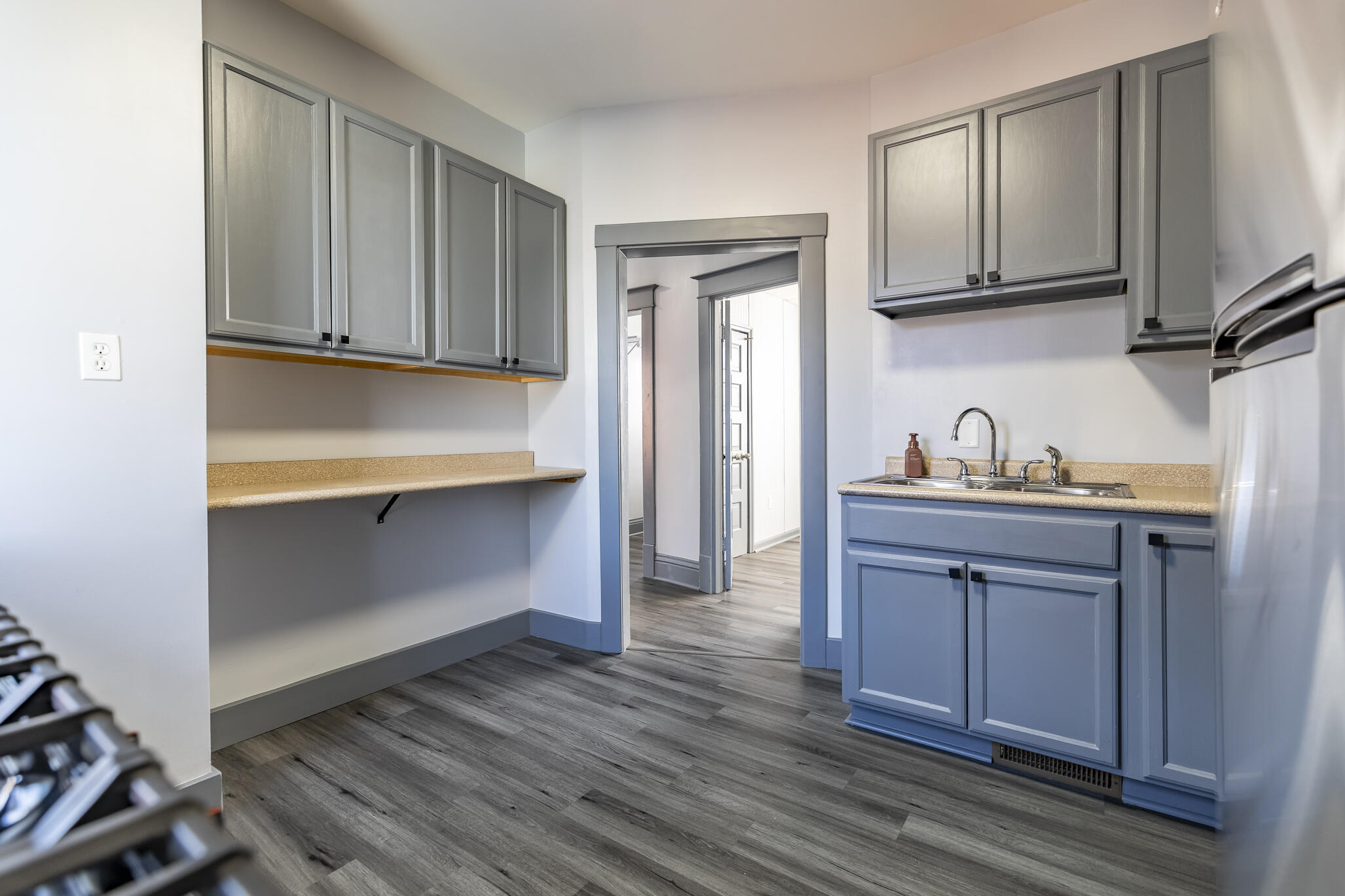 23 Mason Street Hammond, IN 46320 - Photo 31 of 62 a kitchen with stainless steel appliances granite countertop a refrigerator and wooden cabinets