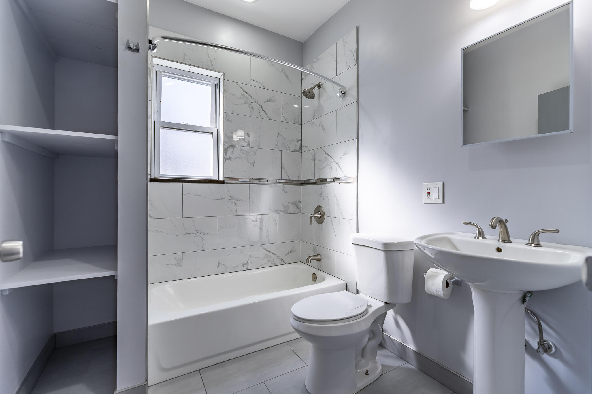 23 Mason Street Hammond, IN 46320 - Photo 36 of 62 a bathroom with a sink toilet and shower