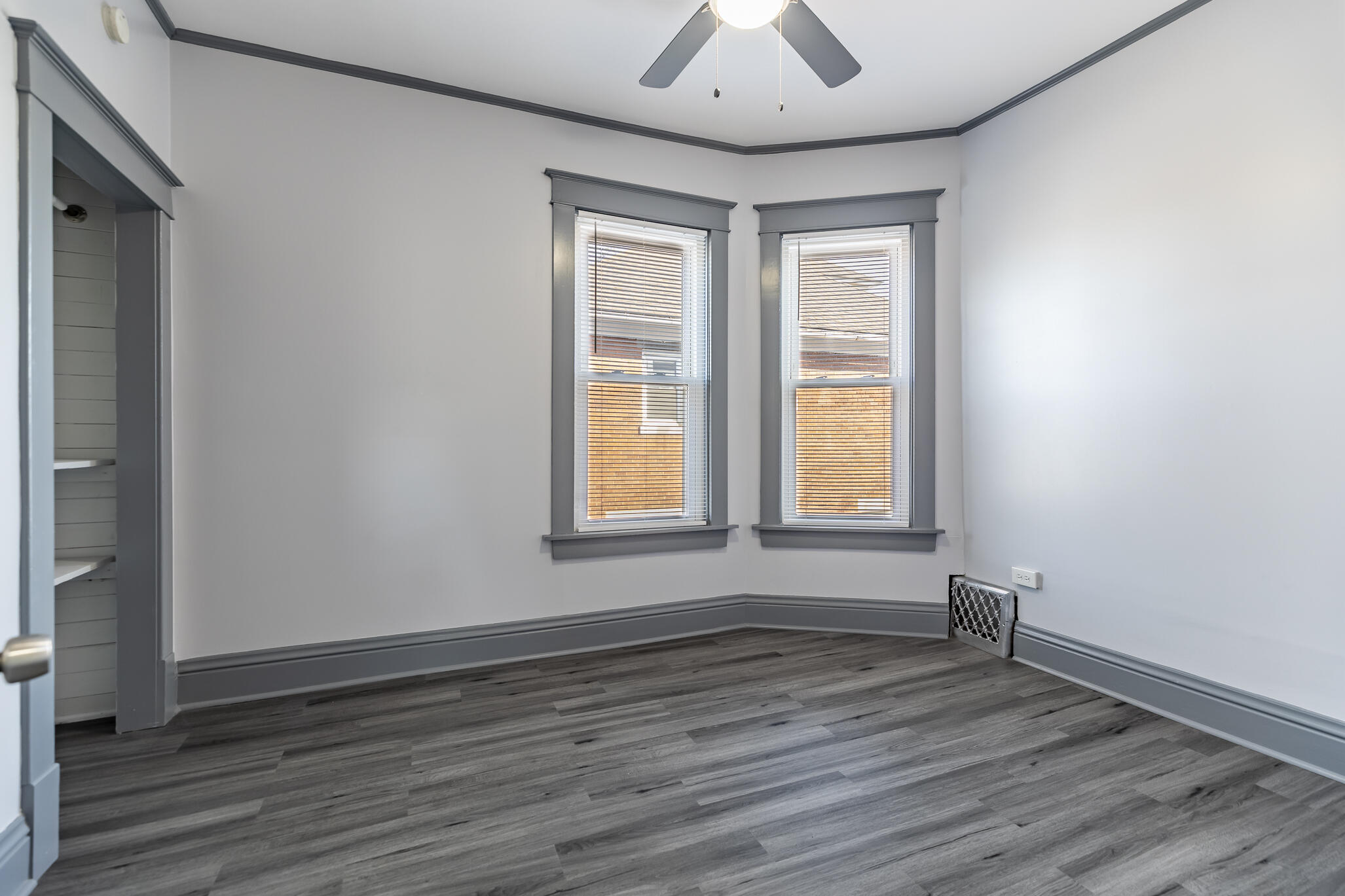 23 Mason Street Hammond, IN 46320 - Photo 38 of 62 a view of an empty room with wooden floor and a window