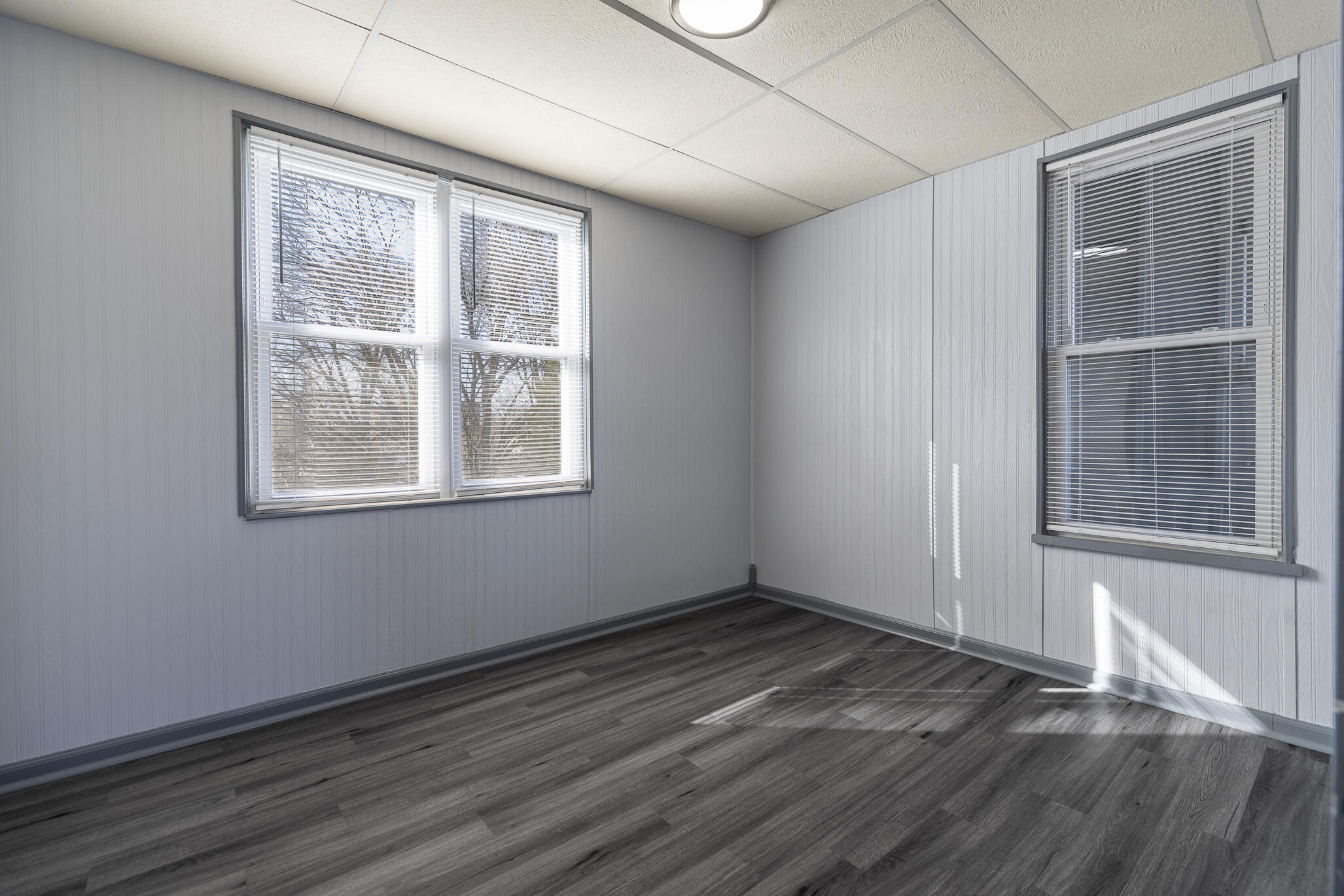 23 Mason Street Hammond, IN 46320 - Photo 40 of 62 a view of an empty room with wooden floor and a window