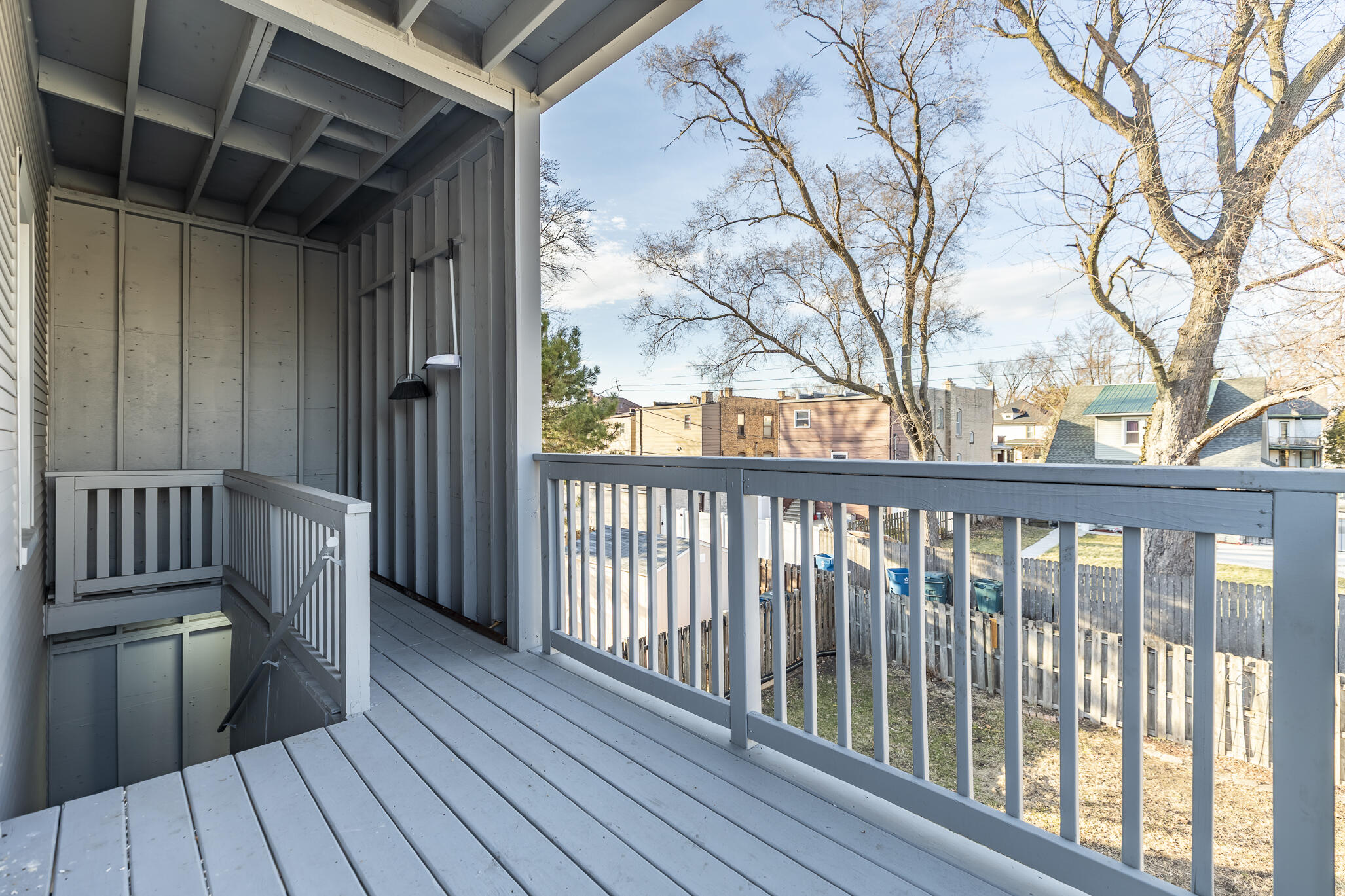 23 Mason Street Hammond, IN 46320 - Photo 42 of 62 a view of a balcony with wooden floor and fence